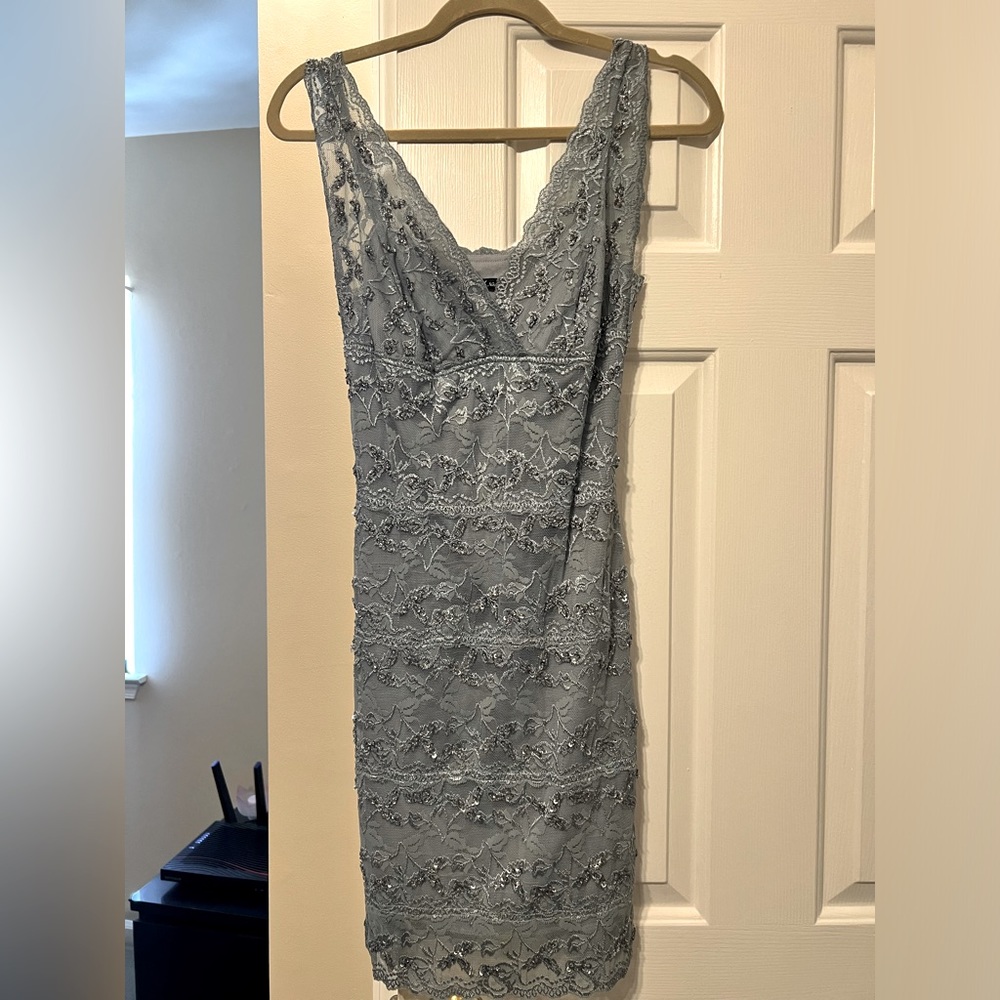 Silver cocktail dress. Fitted. Embroidered with sequins and beads.
